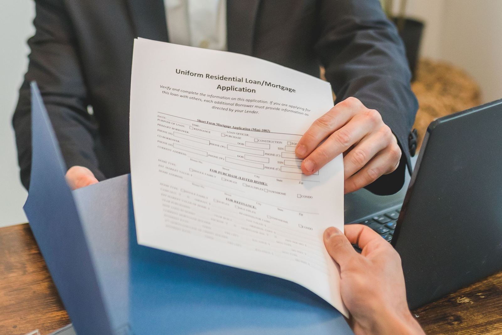 A mortgage application passed across a desk